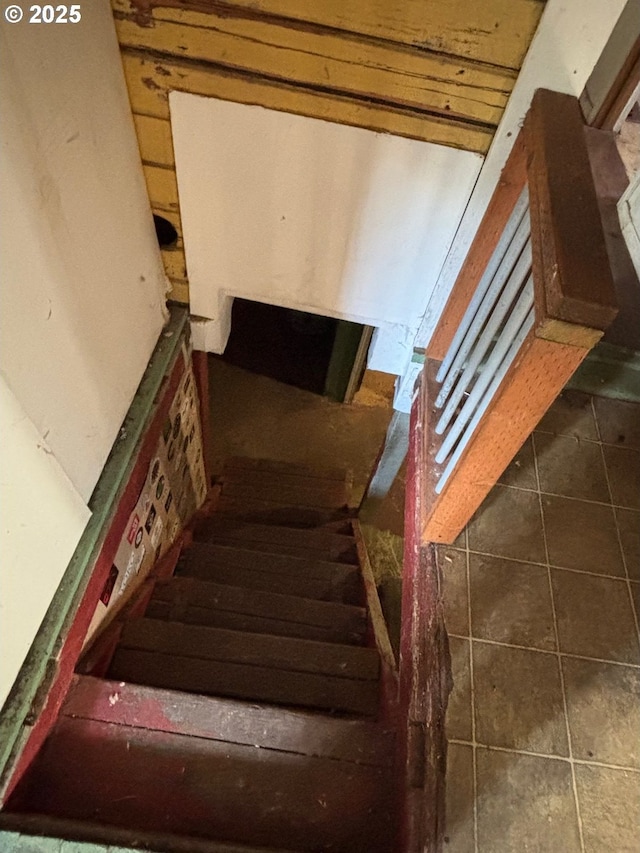 staircase featuring tile patterned floors
