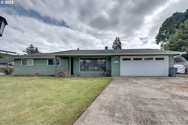 92700 Holly Ln, Astoria, OR 97103 - single story home featuring driveway, a garage, and a front lawn