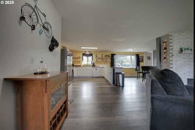 92700 Holly Ln, Astoria, OR 97103 - living area featuring dark wood finished floors and baseboards