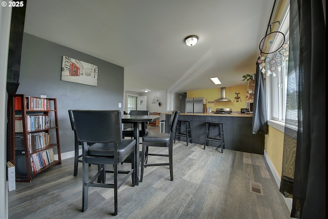 92700 Holly Ln, Astoria, OR 97103 - dining space featuring wood finished floors and baseboards