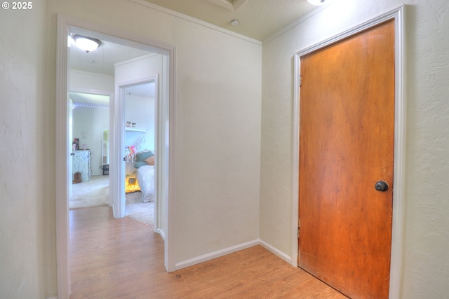 94178 9th St, Gold Beach, OR 97444 - hall featuring light wood-type flooring and a textured wall