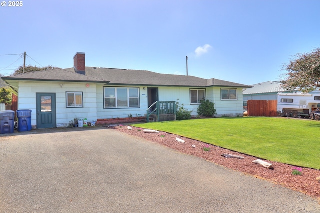 94178 9th St, Gold Beach, OR 97444 - single story home with a chimney, driveway, and roof with shingles