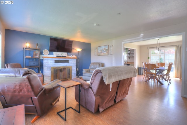 94178 9th St, Gold Beach, OR 97444 - living area featuring wood finished floors and a fireplace