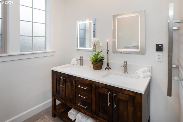 60486 Seventh Mountain Dr, Bend, OR 97702 - bathroom with a sink, baseboards, and double vanity