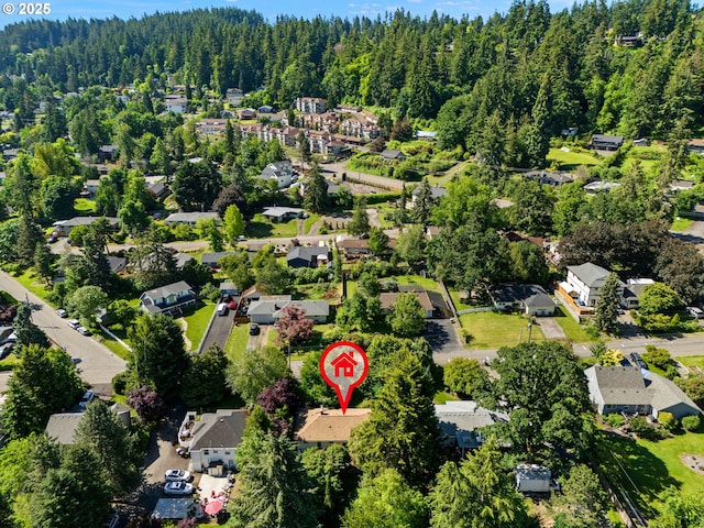 bird's eye view with a residential view and a wooded view