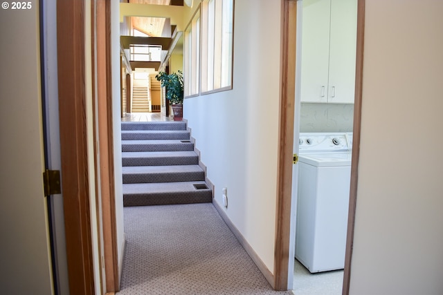 395 Rio Nes Ln, Roseburg, OR 97470 - hallway featuring washer / clothes dryer, light colored carpet, and stairway