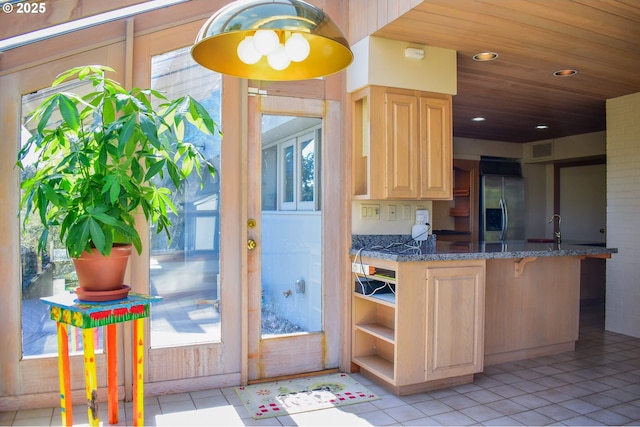 395 Rio Nes Ln, Roseburg, OR 97470 - kitchen with stainless steel fridge with ice dispenser, light brown cabinets, light tile patterned floors, wooden ceiling, and open shelves