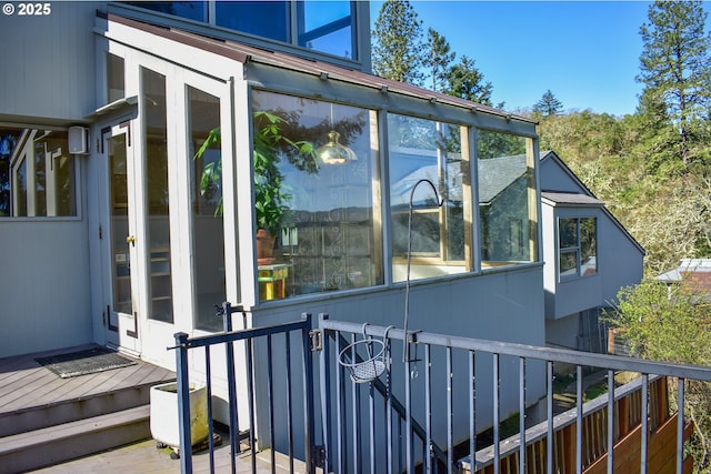 395 Rio Nes Ln, Roseburg, OR 97470 - view of property exterior featuring a sunroom and a wooden deck