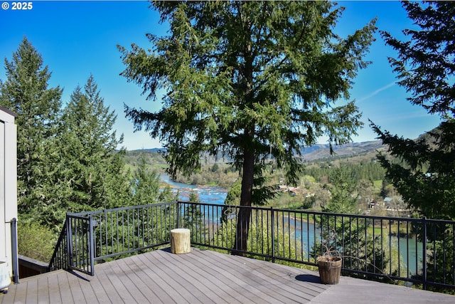 395 Rio Nes Ln, Roseburg, OR 97470 - wooden terrace with a water and mountain view