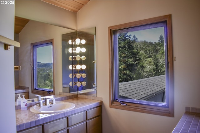 395 Rio Nes Ln, Roseburg, OR 97470 - bathroom featuring vanity, plenty of natural light, and lofted ceiling
