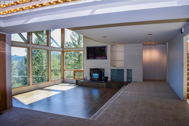 395 Rio Nes Ln, Roseburg, OR 97470 - unfurnished living room featuring a tile fireplace and wood finished floors