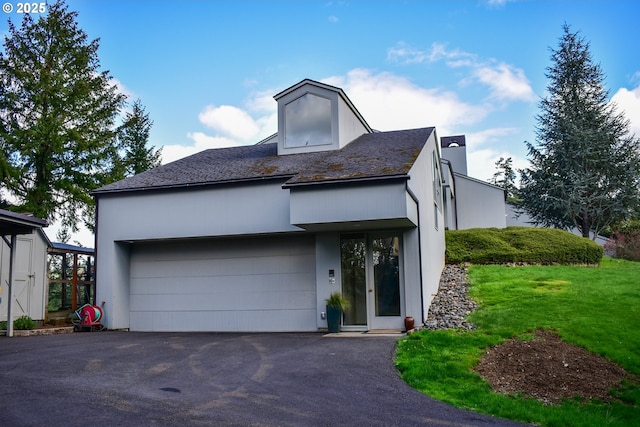 395 Rio Nes Ln, Roseburg, OR 97470 - view of front of house featuring driveway, a garage, a chimney, and a front lawn