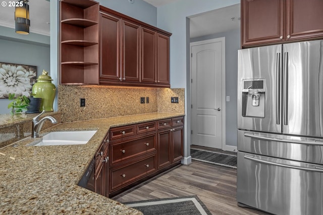 707 N Hayden Island Dr Unit 217, Portland, OR 97217 - kitchen featuring stainless steel fridge, open shelves, dark wood-type flooring, light stone counters, and decorative backsplash