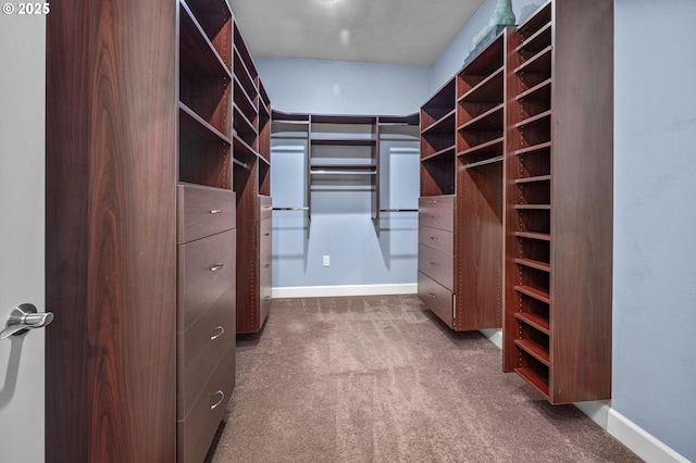 707 N Hayden Island Dr Unit 217, Portland, OR 97217 - walk in closet featuring dark carpet