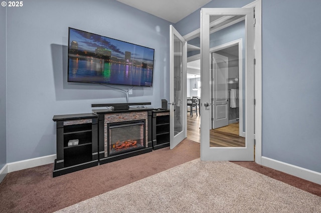 707 N Hayden Island Dr Unit 217, Portland, OR 97217 - carpeted living area featuring a glass covered fireplace and french doors