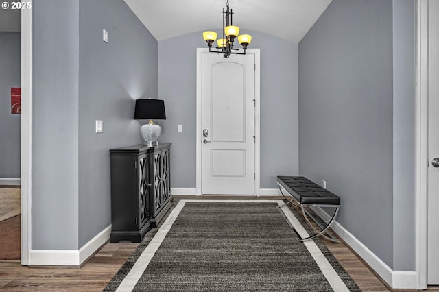 707 N Hayden Island Dr Unit 217, Portland, OR 97217 - foyer entrance with wood finished floors, a chandelier, and vaulted ceiling