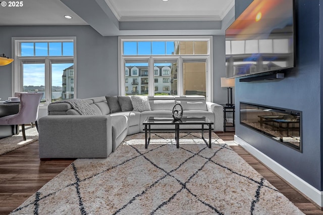 707 N Hayden Island Dr Unit 217, Portland, OR 97217 - living area featuring ornamental molding, wood finished floors, recessed lighting, and a glass covered fireplace