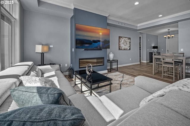 707 N Hayden Island Dr Unit 217, Portland, OR 97217 - living room with wood finished floors, crown molding, a chandelier, recessed lighting, and a tray ceiling