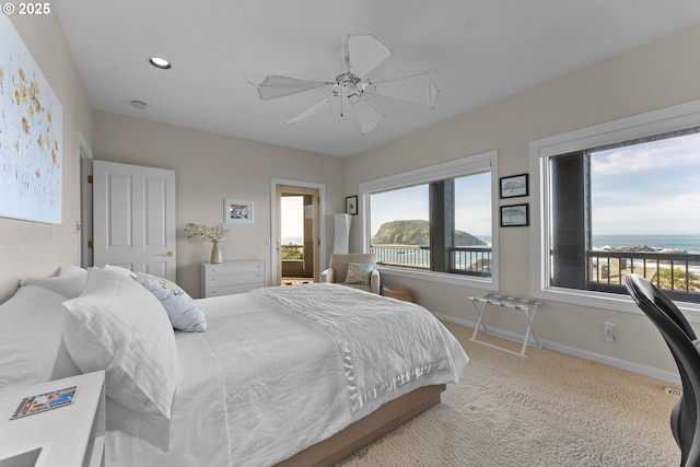 carpeted bedroom featuring a water view, ceiling fan, baseboards, and recessed lighting