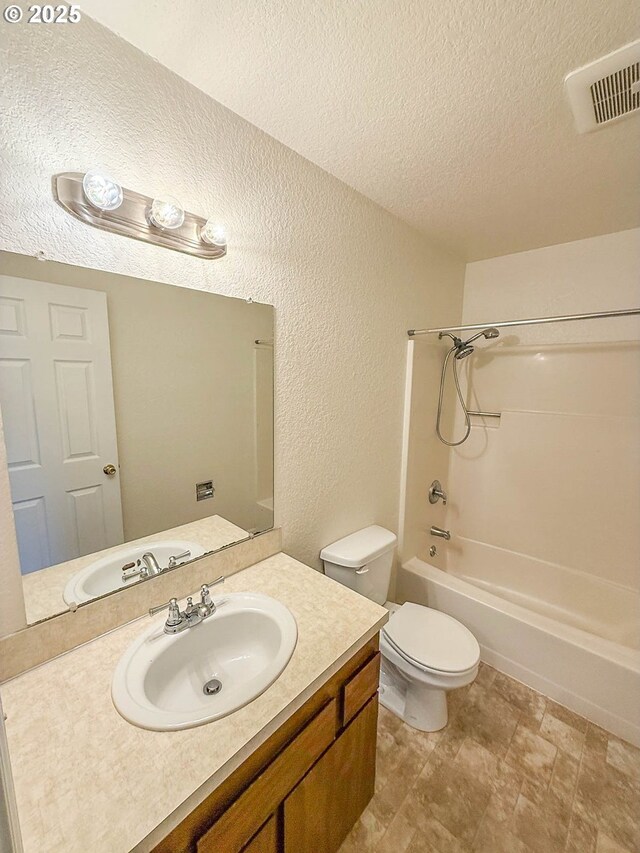1883 Green Ave, Roseburg, OR 97471 - full bathroom featuring a textured wall, a textured ceiling, shower / tub combination, vanity, and toilet