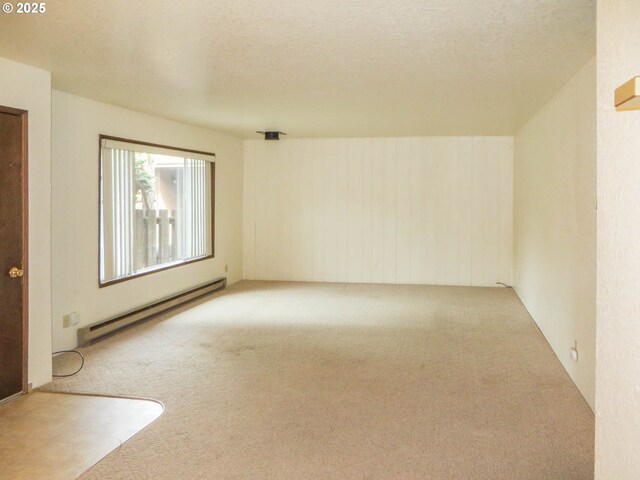 1883 Green Ave, Roseburg, OR 97471 - spare room with a baseboard radiator, carpet, and a textured ceiling