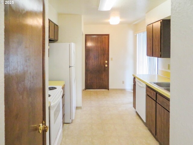 1883 Green Ave, Roseburg, OR 97471 - kitchen featuring white appliances, light countertops, and a sink