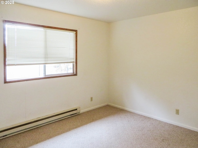 1883 Green Ave, Roseburg, OR 97471 - spare room featuring a baseboard heating unit, carpet floors, and baseboards