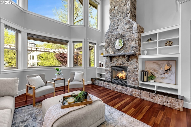 669 W T St, Washougal, WA 98671 - living room with a stone fireplace, wood finished floors, and a towering ceiling