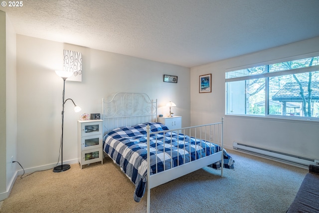 bedroom featuring baseboards, a textured ceiling, carpet, and baseboard heating