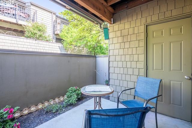 view of patio / terrace featuring fence