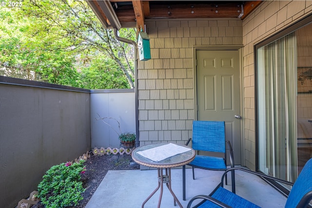 view of patio / terrace featuring fence