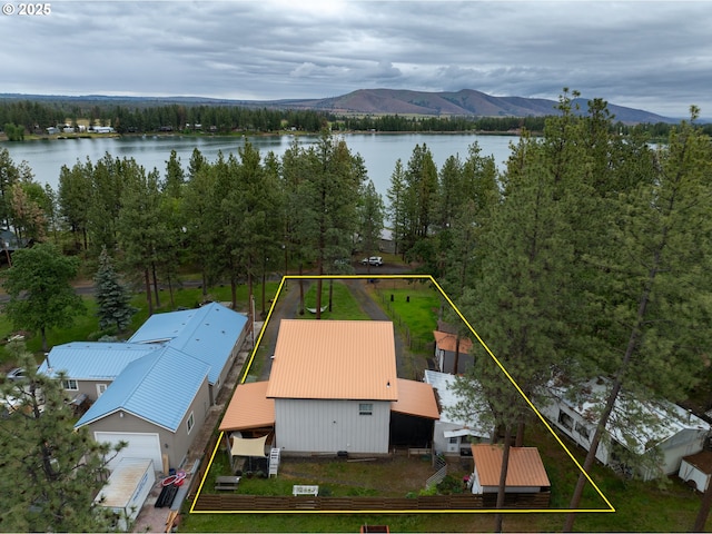 aerial view of property's location featuring a water and mountain view and property boundaries highlighted
