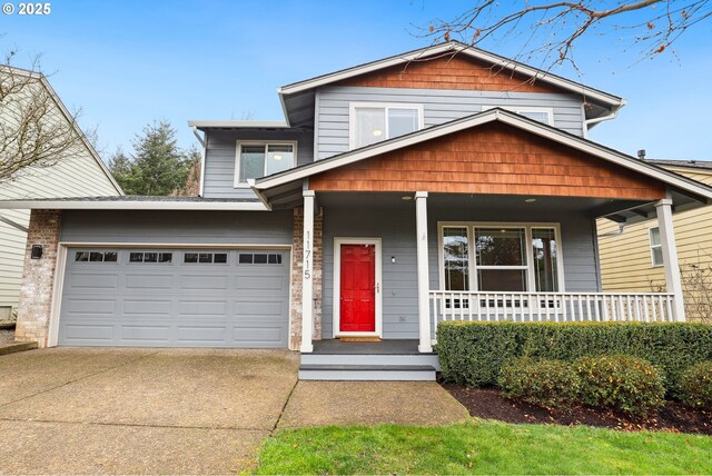 view of front of home with covered porch and a garage