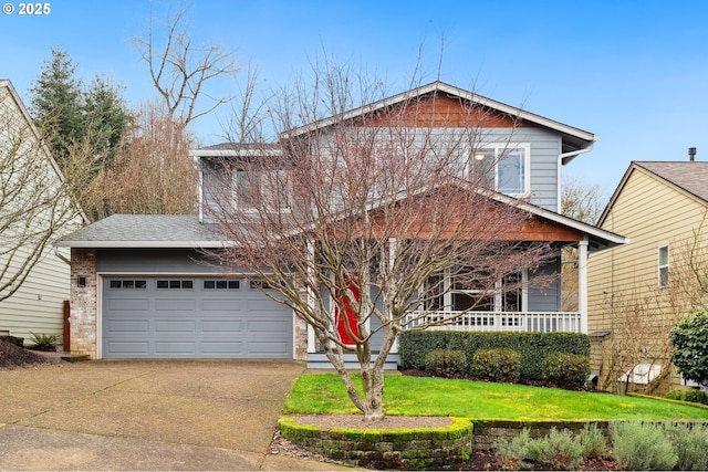 craftsman-style home featuring a garage, a front yard, and covered porch