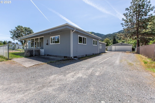 47508 Hansen St, Oakridge, OR 97463 - view of side of home with a mountain view and covered porch