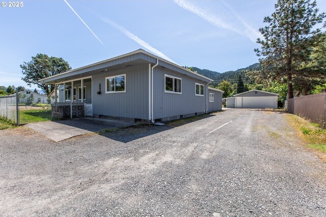 47508 Hansen St, Oakridge, OR 97463 - view of property exterior with a mountain view and covered porch