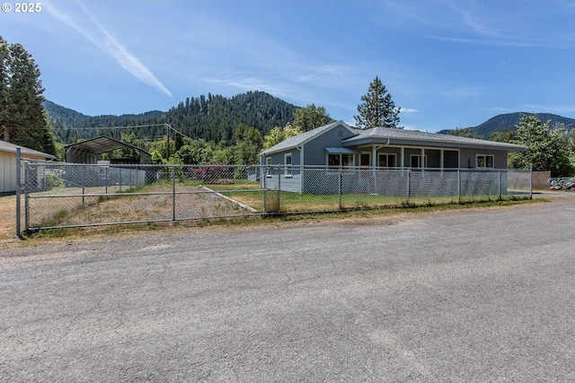 47508 Hansen St, Oakridge, OR 97463 - view of front of property featuring a carport, a mountain view, and driveway