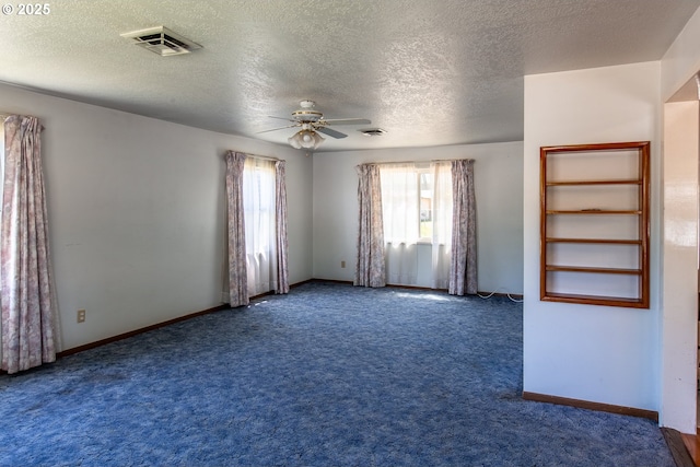 47508 Hansen St, Oakridge, OR 97463 - spare room featuring a ceiling fan, carpet floors, a textured ceiling, and baseboards