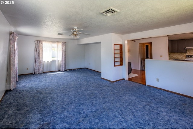 47508 Hansen St, Oakridge, OR 97463 - carpeted spare room featuring a ceiling fan, a textured ceiling, and baseboards