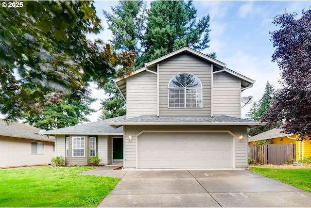 front of property with a garage and a front lawn