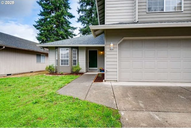 entrance to property featuring a garage and a lawn