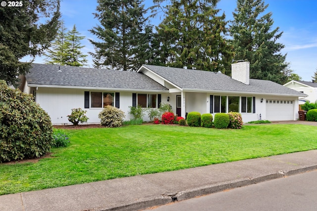 ranch-style house with aphalt driveway, a chimney, a front lawn, and a garage