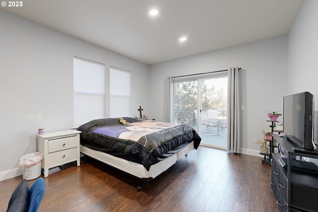 bedroom with dark hardwood / wood-style floors and access to outside