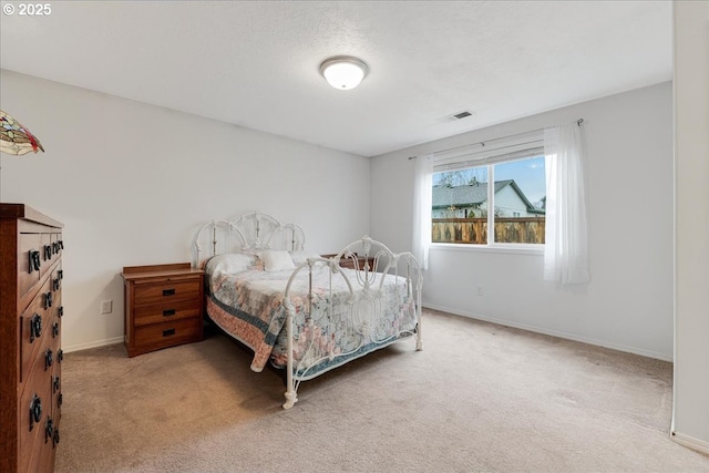 bedroom with light colored carpet