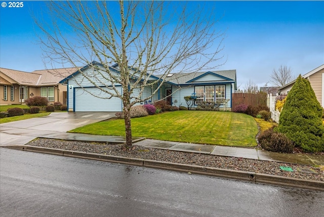 ranch-style home with a garage and a front lawn