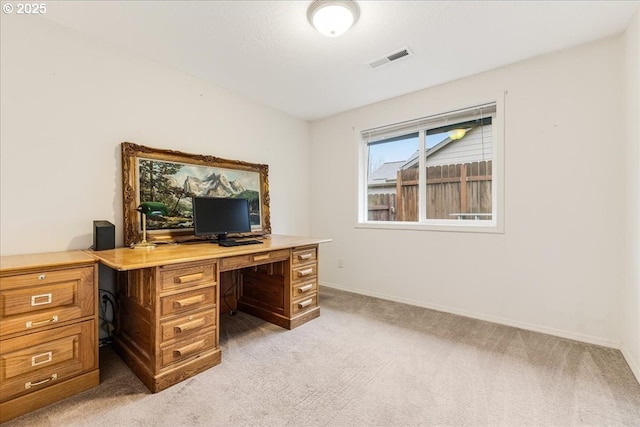 office area featuring light carpet