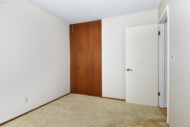 4296 SE Fieldcrest St, Milwaukie, OR 97222 - unfurnished bedroom with a closet, carpet, and a textured ceiling