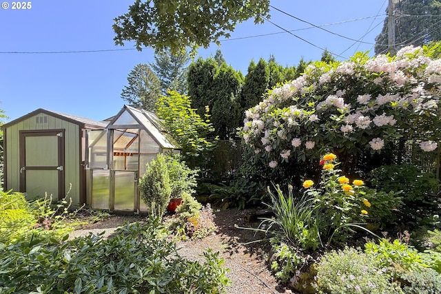 4296 SE Fieldcrest St, Milwaukie, OR 97222 - view of yard with an outbuilding and a greenhouse