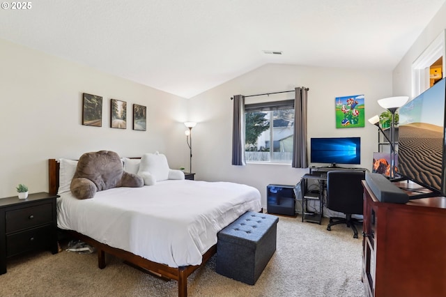 bedroom featuring light carpet, vaulted ceiling, and visible vents