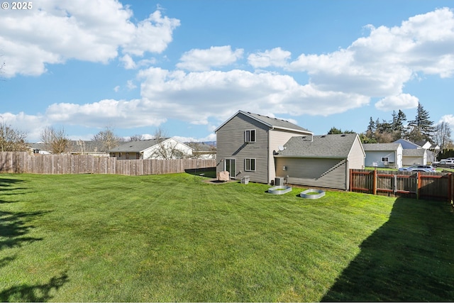 view of yard with a residential view and a fenced backyard